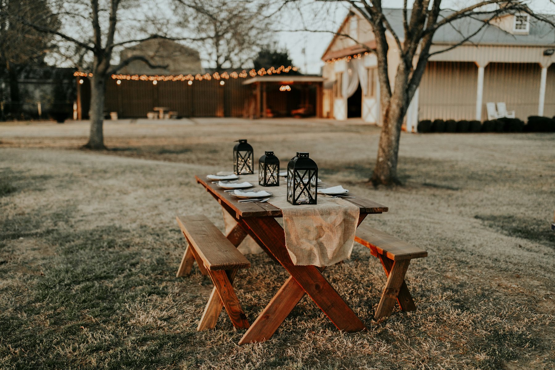 A wedding invitation suite on a rustic table