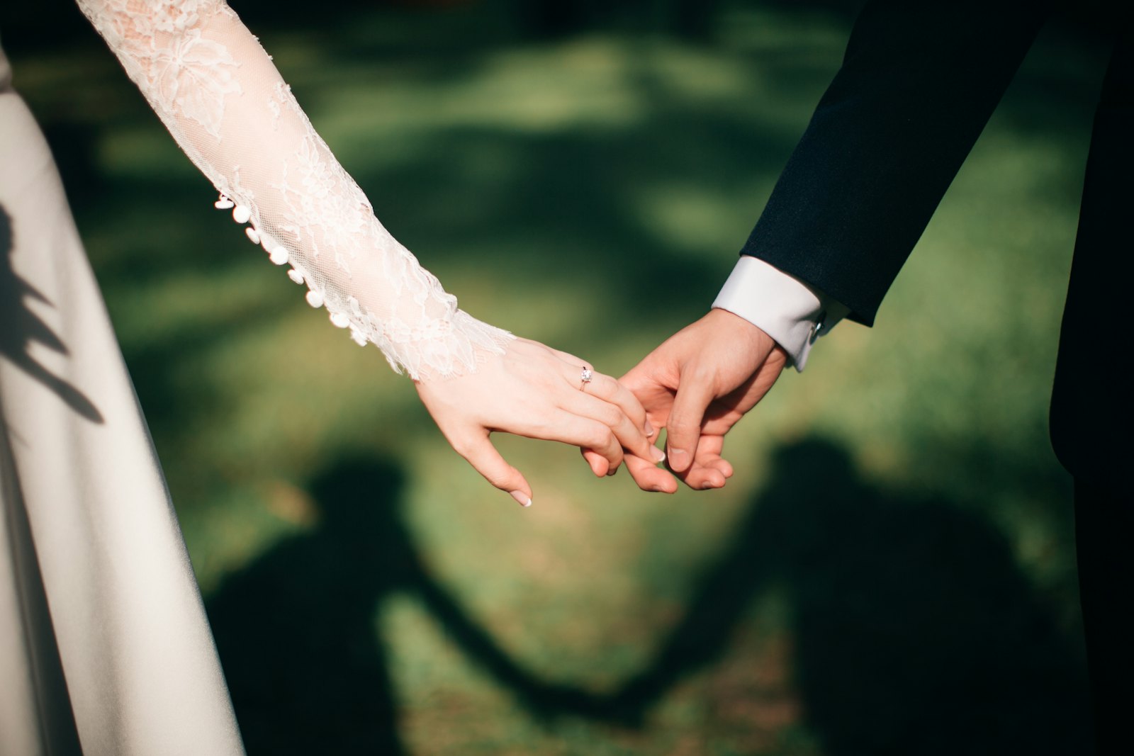 Hands exchanging rings during wedding ceremony